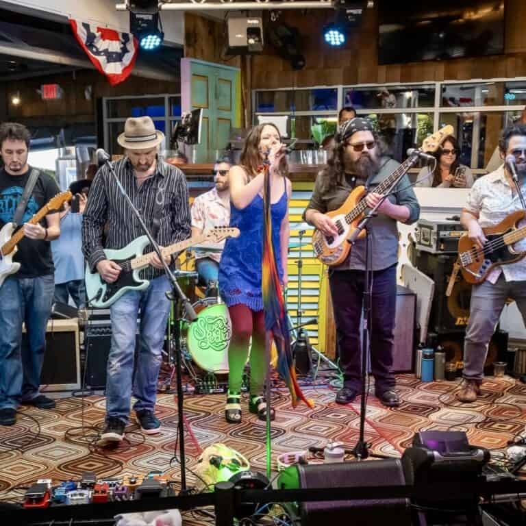 Live band with a singer performing inside Fager's Island bayside bar in Ocean City, Maryland