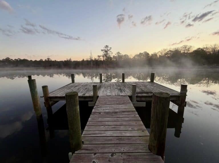 Misty sunrise over dock on the bay in Ocean City Maryland