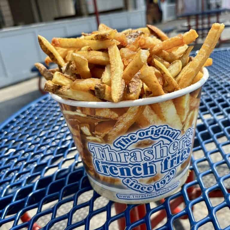 Bucket of fresh-cut boardwalk french fries with vinegar Thrasher's on the Ocean City boardwalk