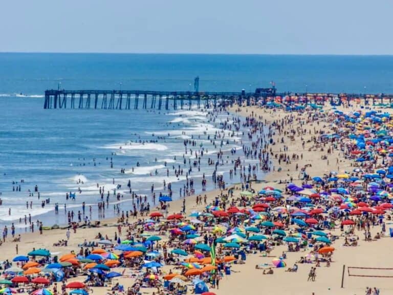 Wide sandy beach and the three-mile Boardwalk in Ocean City, Maryland in summer