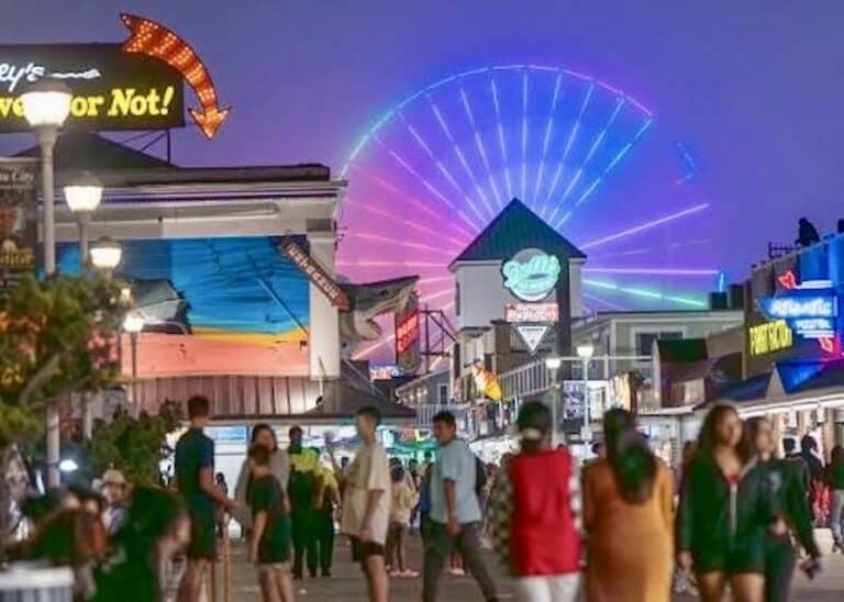 Jolley Rogers Amusement park rides lit up at dusk on the boardwalk