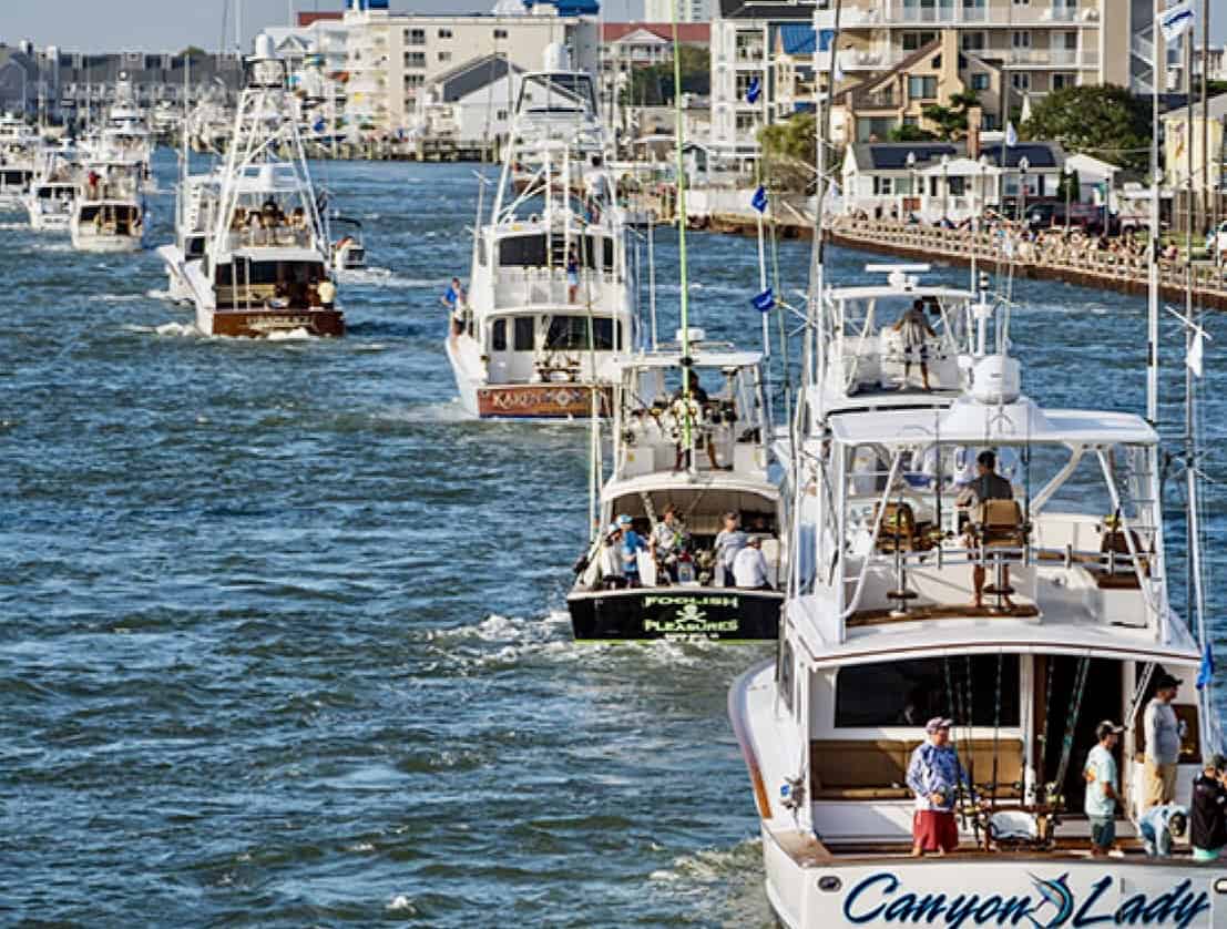 Sportfishing boats including Canyon Lady heading out through the Ocean City, Maryland inlet for the White Marlin Open