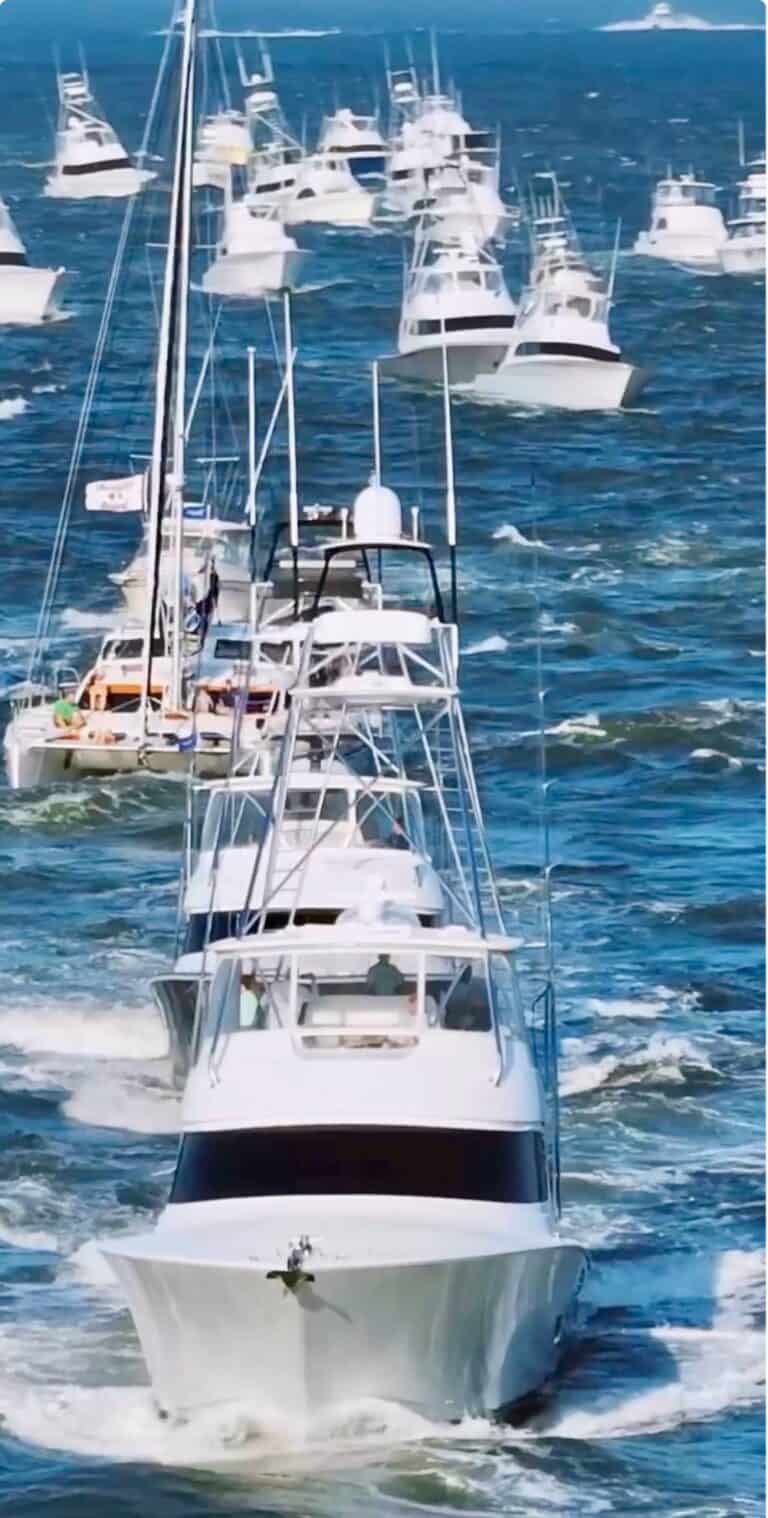 Sportfishing boats heading out of the Ocean City Inlet at sunrise during the White Marlin Open